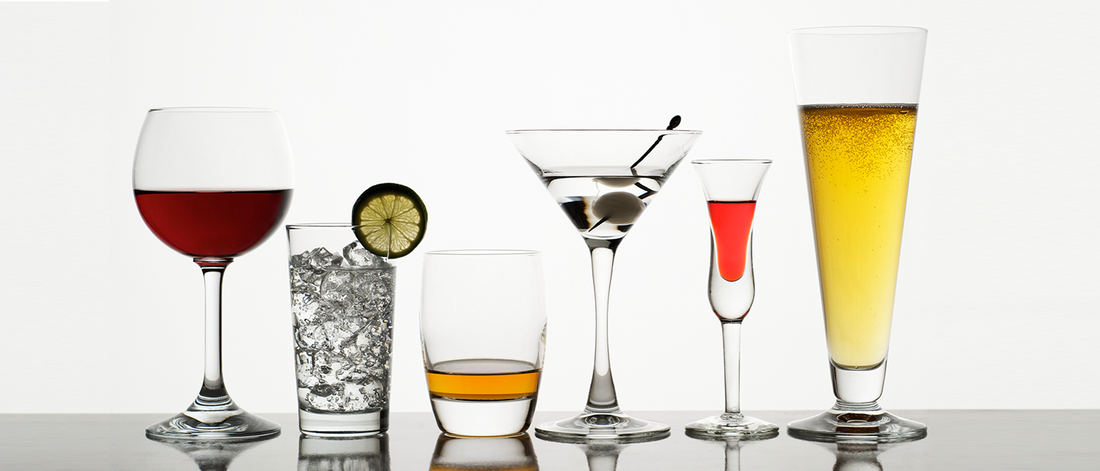 Various alcoholic beverages in clear glasses