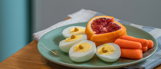 Hard-boiled eggs with fruit and vegetable