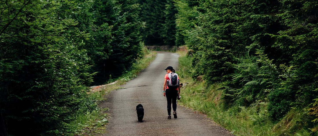 Woman hiking with dog