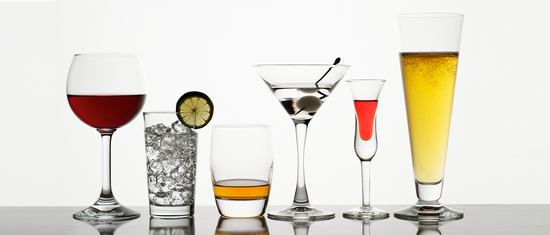 Various alcoholic beverages in clear glasses